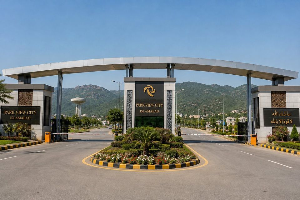 The main entrance gate at Park View City, Islamabad, with the Margalla hills behind